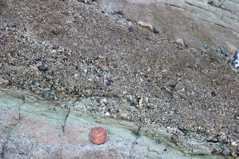 Graded bedding: pebble conglomerate up into sandstone.